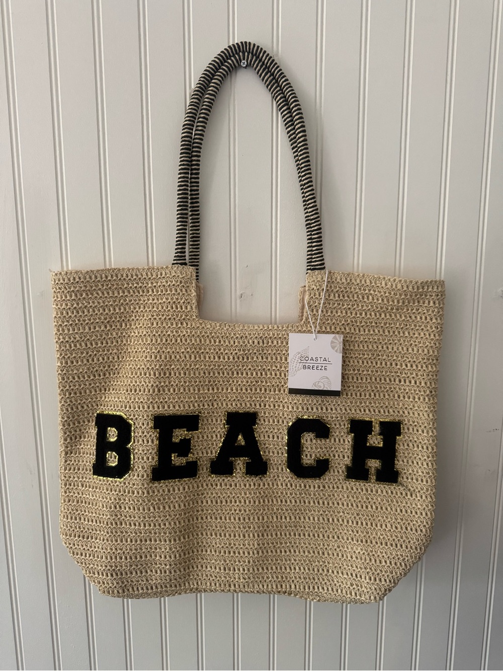 Beige Straw Tote Bag with Black 'BEACH' Lettering